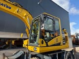 2019 Komatsu PW148-11 wheel excavator, side view of cab and boom