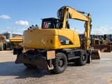2012 Caterpillar M313D wheel excavator rear three-quarter view