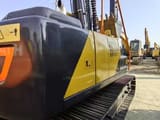 2023 Volvo EC140 crawler excavator, rear three-quarter view