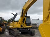 2025 Komatsu PC300 crawler excavator, front three-quarter view