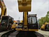 2023 Caterpillar 323DL crawler excavator, front view