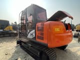 2023 Hitachi ZX75 crawler excavator, rear three-quarter view