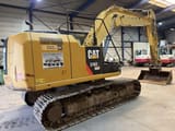 2014 Caterpillar 316EL crawler excavator, rear three-quarter view