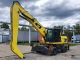 2011 Caterpillar M318D MH material handler, side profile view