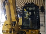 2023 Komatsu PW138MR wheel excavator cab and boom view