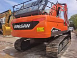 2024 Doosan DX225LCA crawler excavator, rear three-quarter view