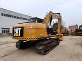 2016 Caterpillar 320D crawler excavator, rear three-quarter view