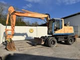 1997 Caterpillar M315 wheel excavator, side profile view