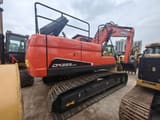 2024 Doosan DX225LCA crawler excavator, rear three-quarter view