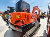 2024 Doosan DH55 mini excavator, front three-quarter view