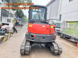 2023 Kubota KX057-4 mini excavator, rear view
