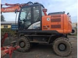 2014 Hitachi Zaxis 140W wheel excavator, side profile view