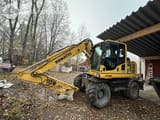 2014 Komatsu PW148-8 wheel excavator side view