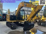 2023 Caterpillar 307.5 mini excavator, rear three-quarter view