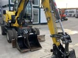 2023 Wacker Neuson EW65 wheel excavator, front three-quarter view