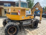 2000 Liebherr A310B wheel excavator, rear three-quarter view