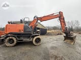 2013 Hitachi Zaxis 140W wheel excavator, side view
