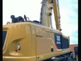 2018 Caterpillar MH3024 material handler, rear three-quarter view