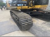 2015 Caterpillar 320D crawler excavator side view of tracks and undercarriage
