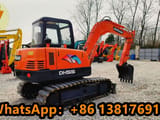 2021 Doosan DH55 mini excavator, rear three-quarter view