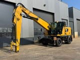 2019 Caterpillar MH3024 material handler, side profile view