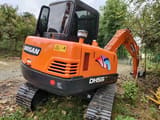 2022 Doosan DH55 mini excavator, rear three-quarter view