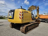 2015 Caterpillar 323E crawler excavator rear three-quarter view