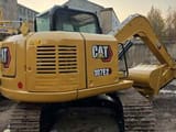 2024 Caterpillar 307E2 excavator rear three-quarter view