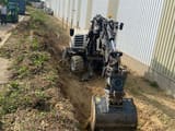 2017 Schaeff TW95 wheel excavator, front-quarter view