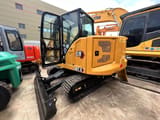 2023 Caterpillar 307.5 mini excavator, rear three-quarter view