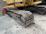 2015 Caterpillar 325B crawler excavator undercarriage view