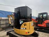 2024 Caterpillar 303.5E mini excavator, rear three-quarter view