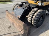 2008 Caterpillar M318D wheel excavator dozer blade view