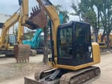 Caterpillar 305.5E mini excavator, front three-quarter view