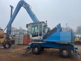 2011 Fuchs MHL335 material handler, side profile view