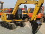 2025 Caterpillar 307.5E2 mini excavator, three-quarter rear view