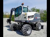 2017 Schaeff TW95 wheel excavator, rear three-quarter view