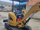 2022 Caterpillar 303E CR mini excavator, rear three-quarter view