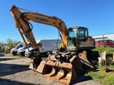 2010 Hyundai R140W-9 wheel excavator, front three-quarter view