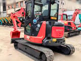 Hitachi ZX55USR-5A mini excavator, rear three-quarter view