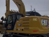 2023 Caterpillar 320GC crawler excavator, rear three-quarter view