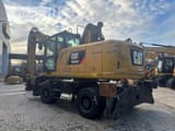 2015 Caterpillar MH3022 material handler, rear three-quarter view