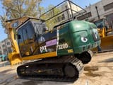Excavadora de orugas Caterpillar 320DL 2023, vista trasera tres cuartos