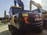 2023 Volvo EC140 crawler excavator, rear three-quarter view