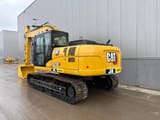 2026 Caterpillar 323D3 crawler excavator, rear three-quarter view