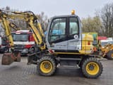 2009 New Holland MH 2.6 wheel excavator, side view