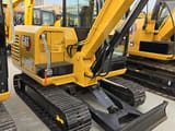 2024 Caterpillar 306E2 mini excavator, rear three-quarter view