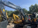 2023 Hyundai 305-9 crawler excavator, front three-quarter view