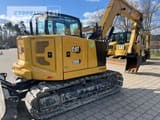 2024 Caterpillar 308 mini excavator, rear three-quarter view