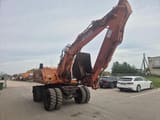 2001 Atlas 1404 wheel excavator, rear three-quarter view